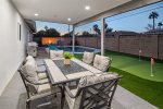 Covered patio with outdoor dining and BBQ Grill